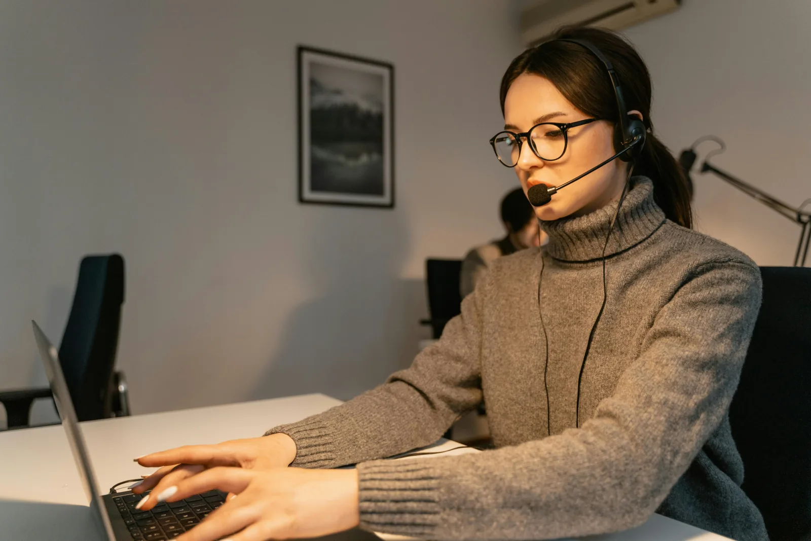 Operator reviewing calls at a desk