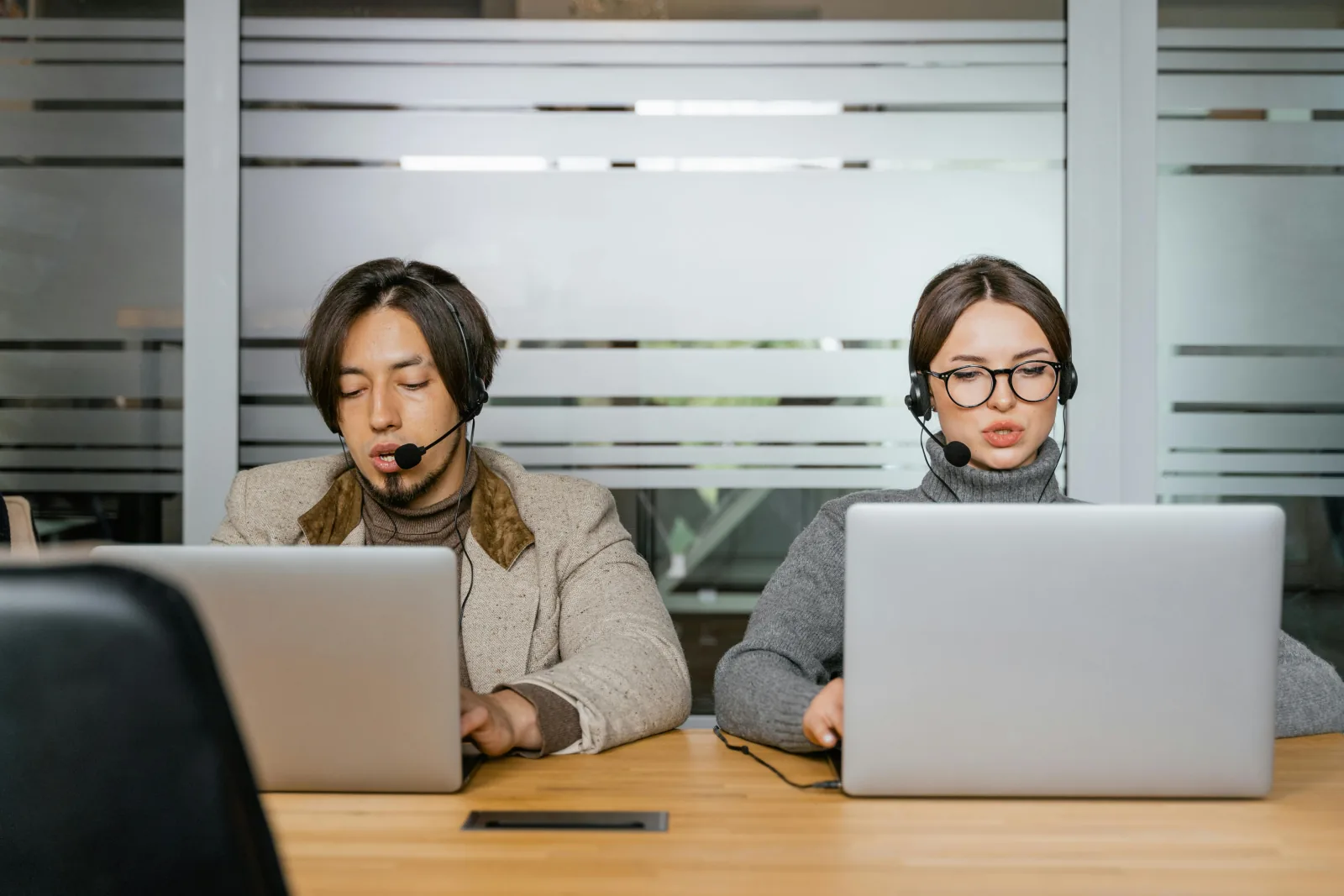 Operator handling scheduling calls at a desk